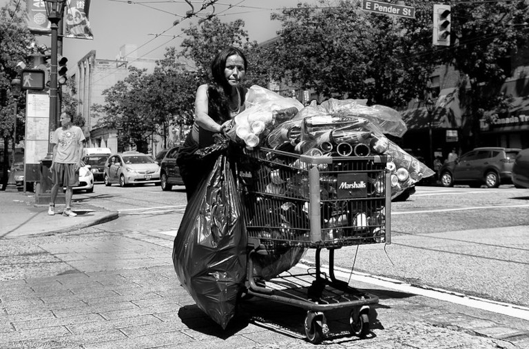 homeless woman with shopping cart